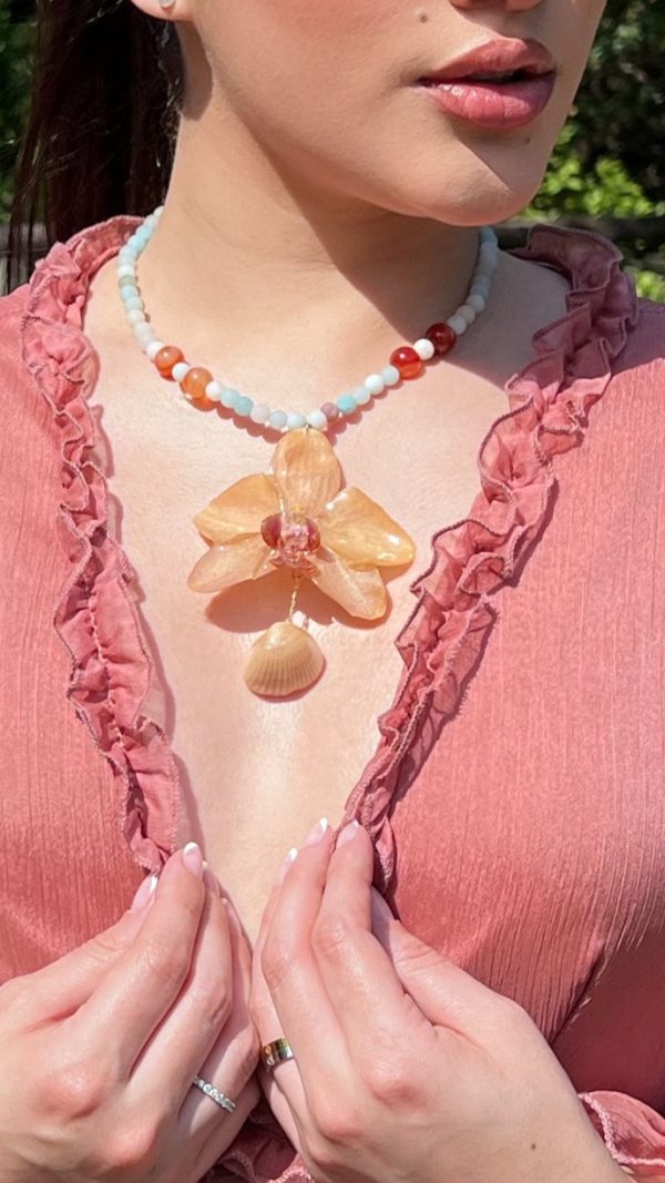Paulina Altuve Showing Sunset Tide Orchid Necklace – Handcrafted with Carnelian, Amazonite & Real Shell Accent