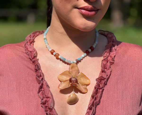 Paulina Altuve Wearing Sunset Tide Orchid Necklace – Handcrafted with Carnelian, Amazonite & Real Shell Accent
