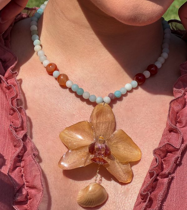 Paulina Altuve's close up of Sunset Tide Orchid Necklace – Handcrafted with Carnelian, Amazonite & Real Shell Accent