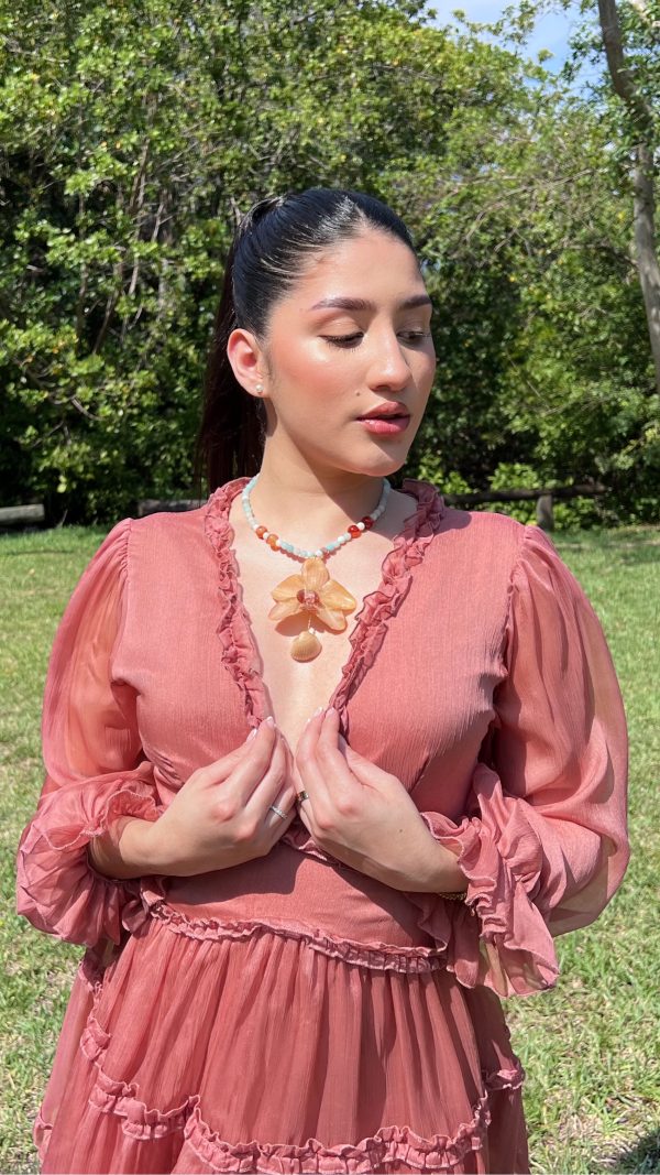 Paulina Altuve Showing Sunset Tide Orchid Necklace – Handcrafted with Carnelian, Amazonite & Real Shell Accent