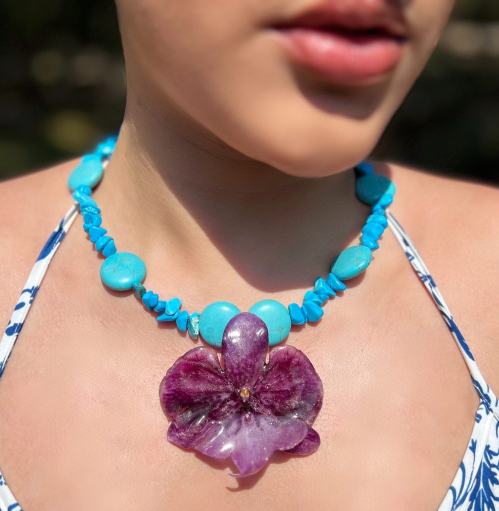 Paulina Altuve wearing the Spirit Sky Orchid Necklace – Handcrafted with Purple Orchid & Turquoise Stones
